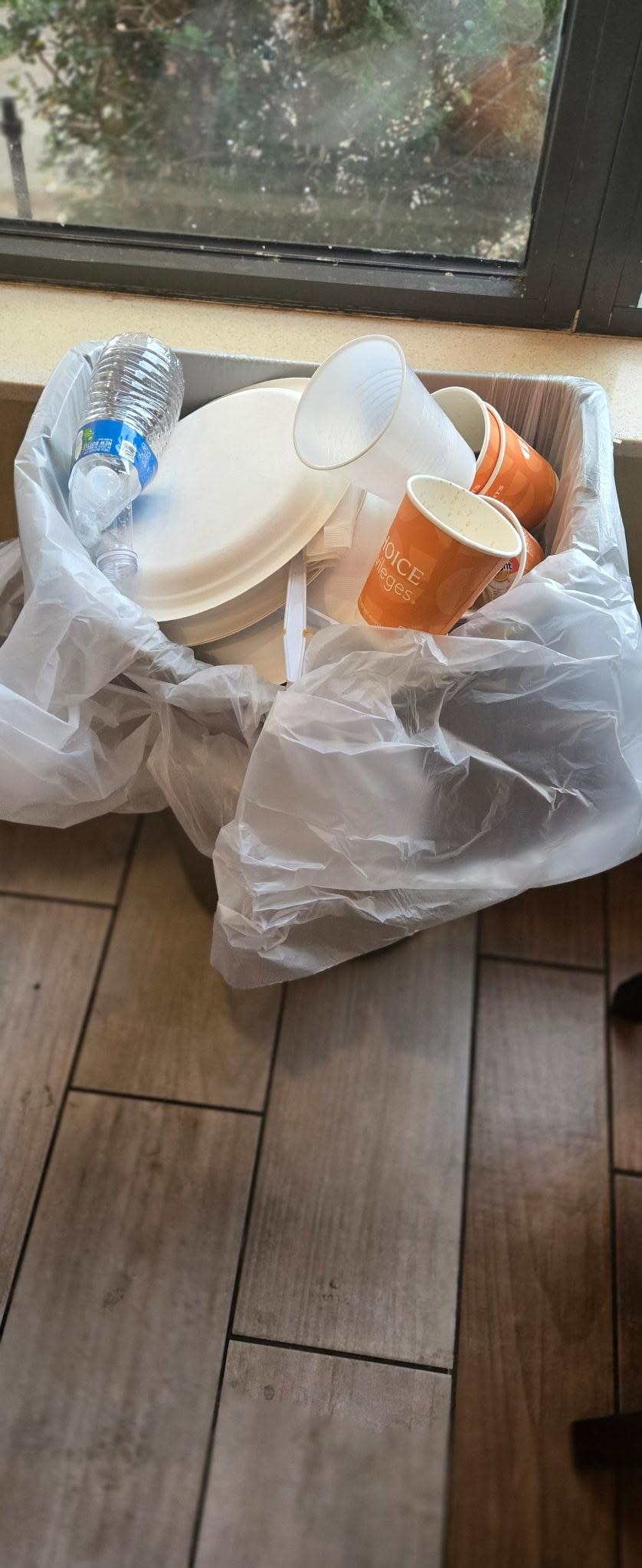 Garbage can full after breakfast and she didn't take it out of the can until after 8 p.m. It was running over as people kept adding to it all day. It was on floor and windowsill. 