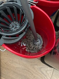 Dirty mop in entry way