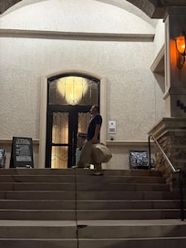 Carrying bags through the front entrance.