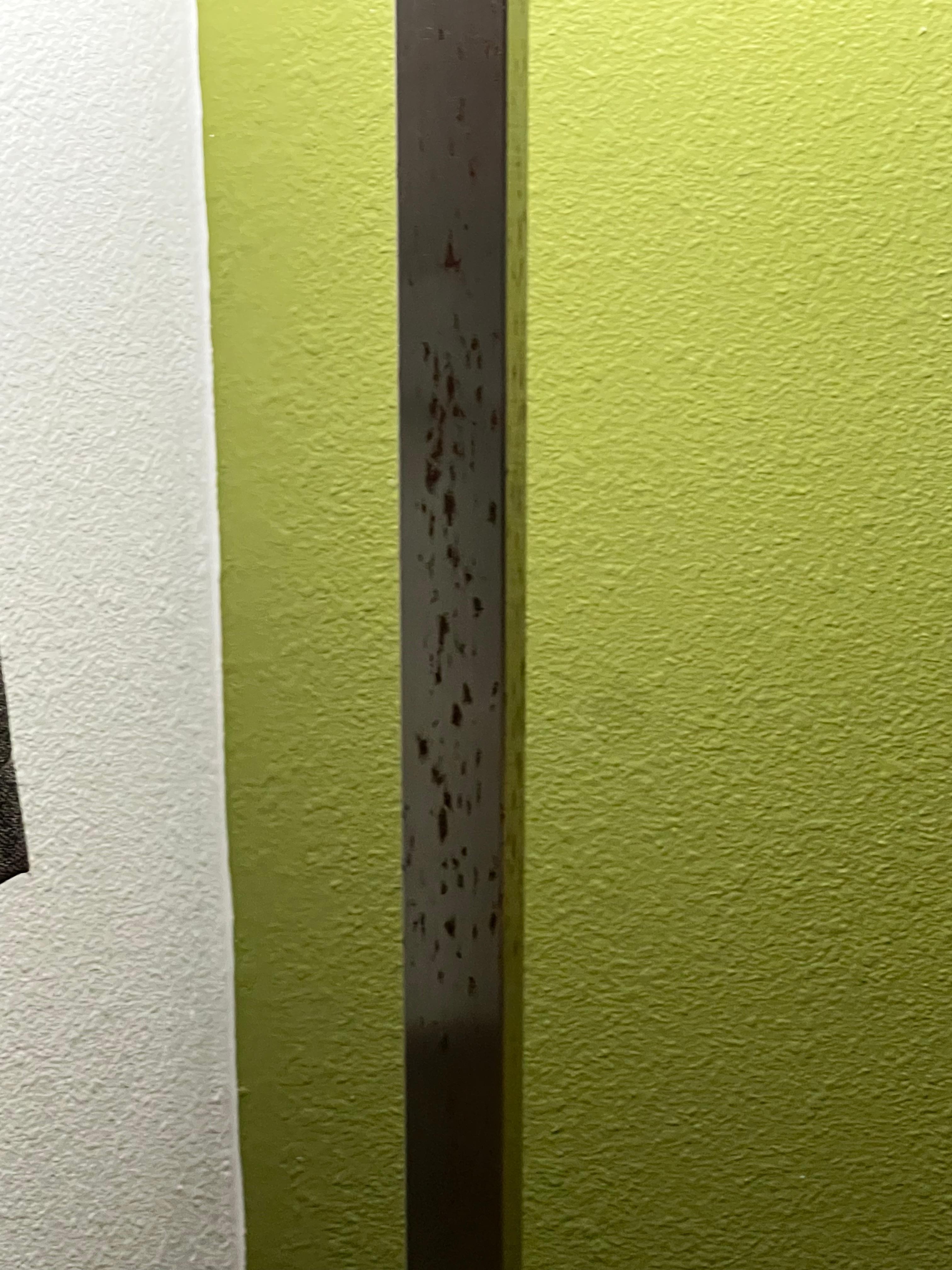 A lamp that is rusted.