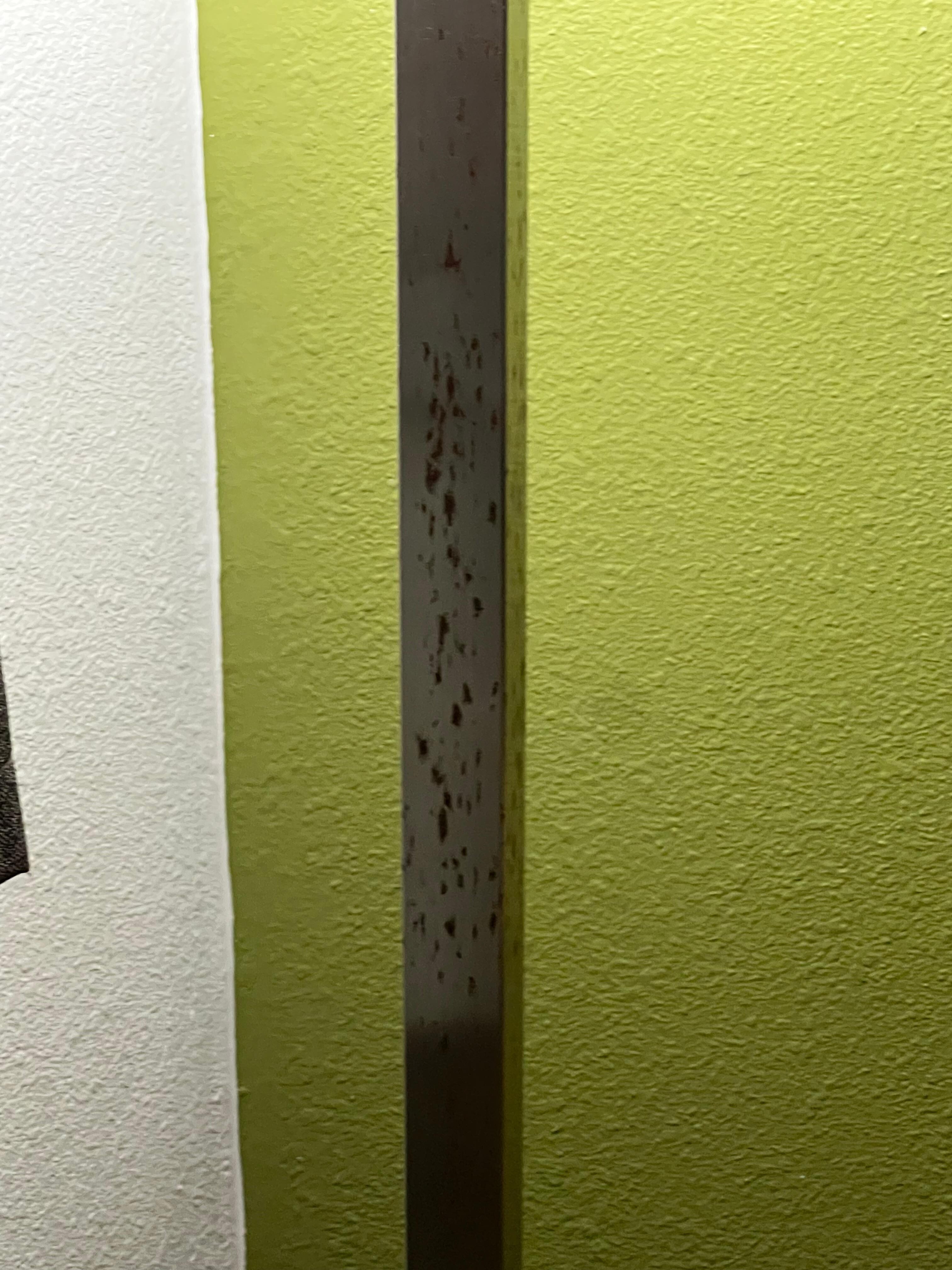 A lamp that is rusted.