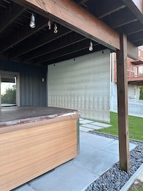 Outdoor patio with hot tub