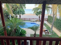Upper deck, overlooking the pool and the beach just a few feet away.