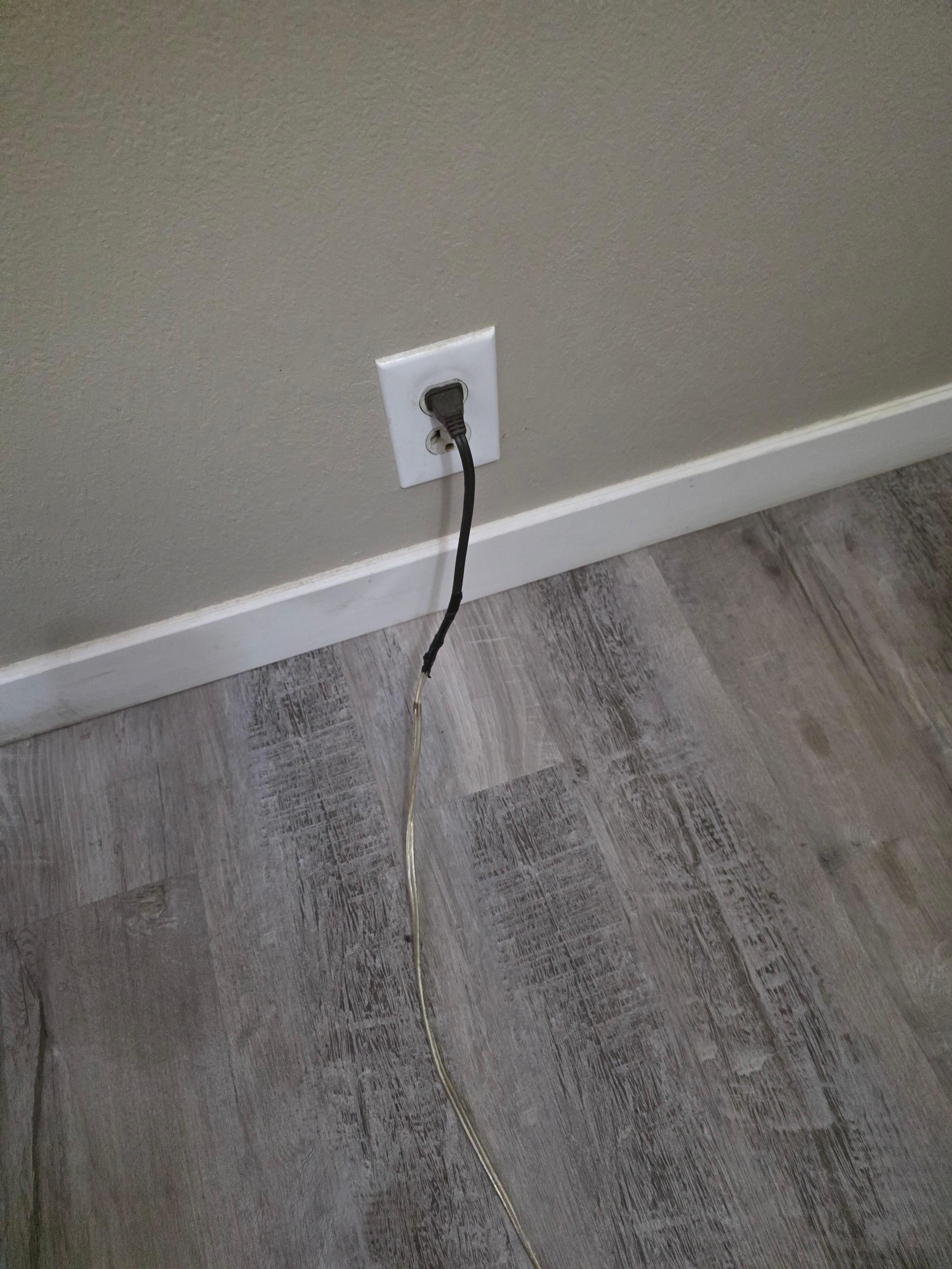 Fire hazard I noticed behind their couch. This was connected tona standing lamp