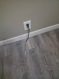 Fire hazard I noticed behind their couch. This was connected tona standing lamp