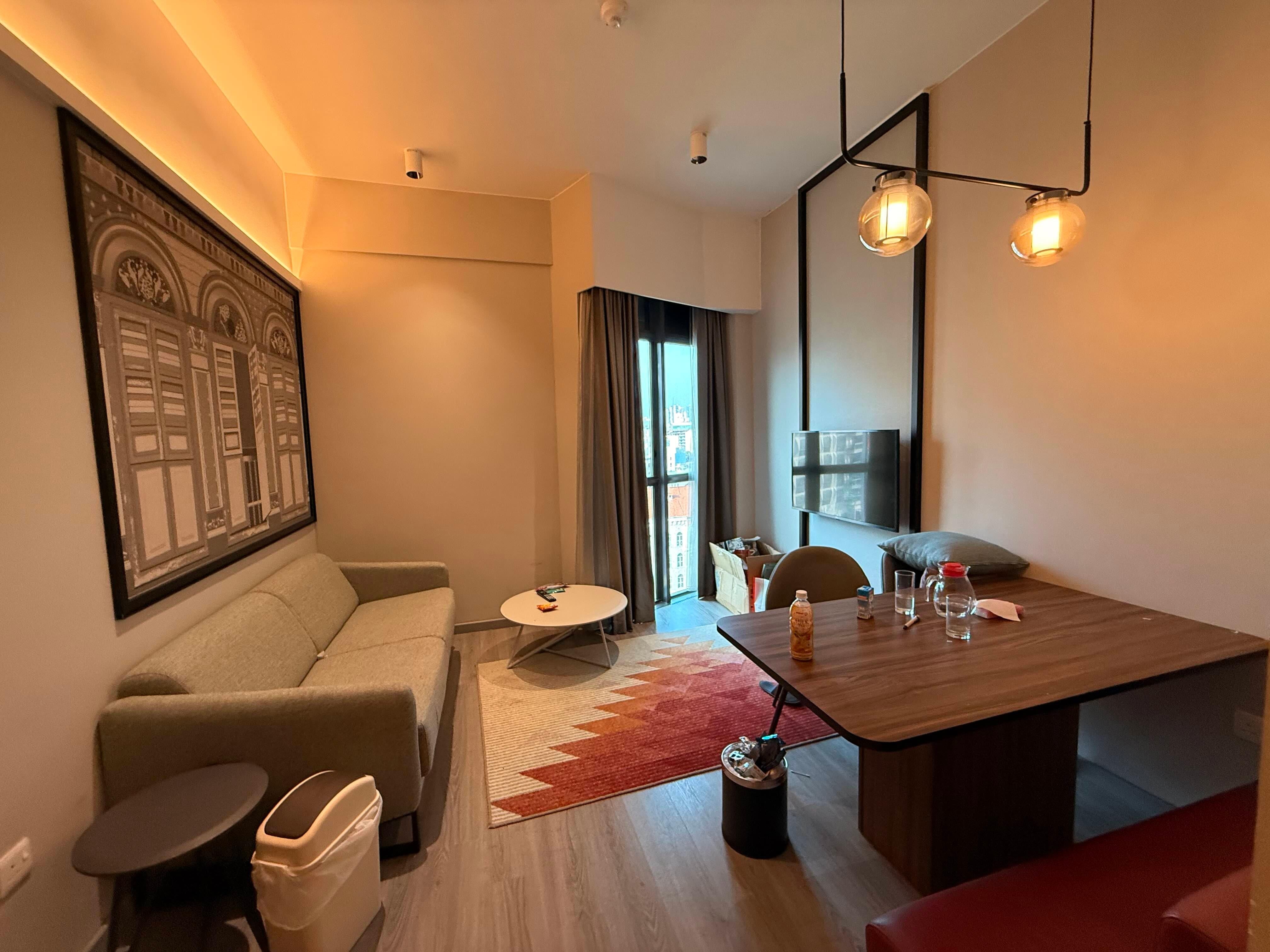 Living area, decent size. The TV's a bit small but you can hook up a HDMI to it watch netflix. Full suite of satellite channels including HBO, intl news channels built-in the TV.