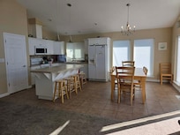 About 5 feet from the kitchen table was the gas burner.