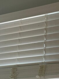 The dirty blinds in the kitchen