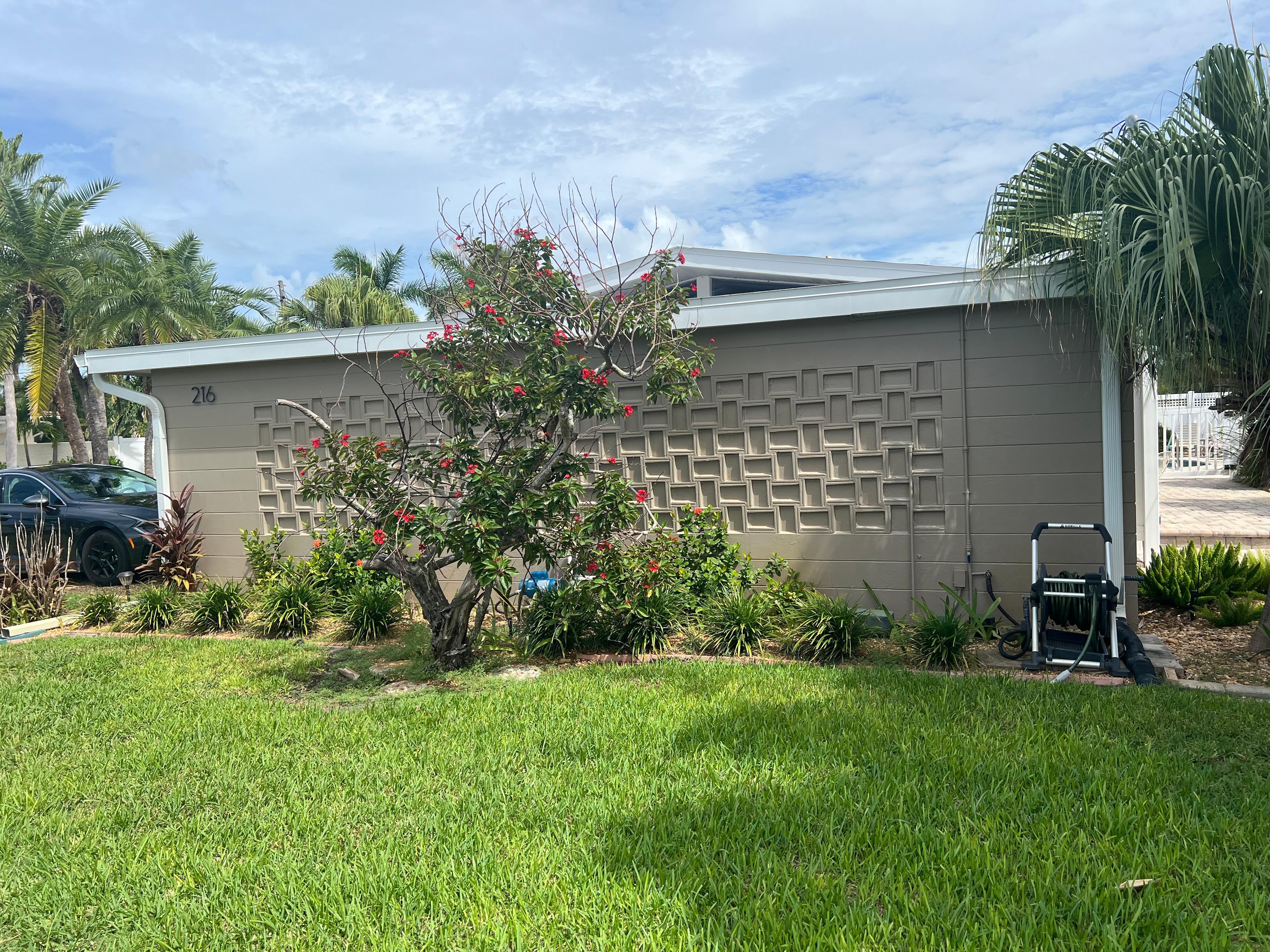 Side of house with cool mcm original brick design. 