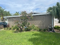 Side of house with cool mcm original brick design.