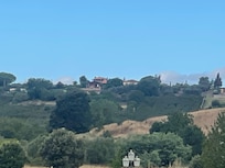 Het huisje vanaf de golfbaan in het dal