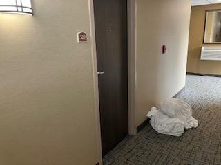 Linen from housekeeping left on the floor in a hallway from 3:00 pm till after 8:30am the next day. Fire hazard, trip hazard, and just gross.The front desk was told at 3:30 pm and she said, "Housekeeping goes home at 3:00". 