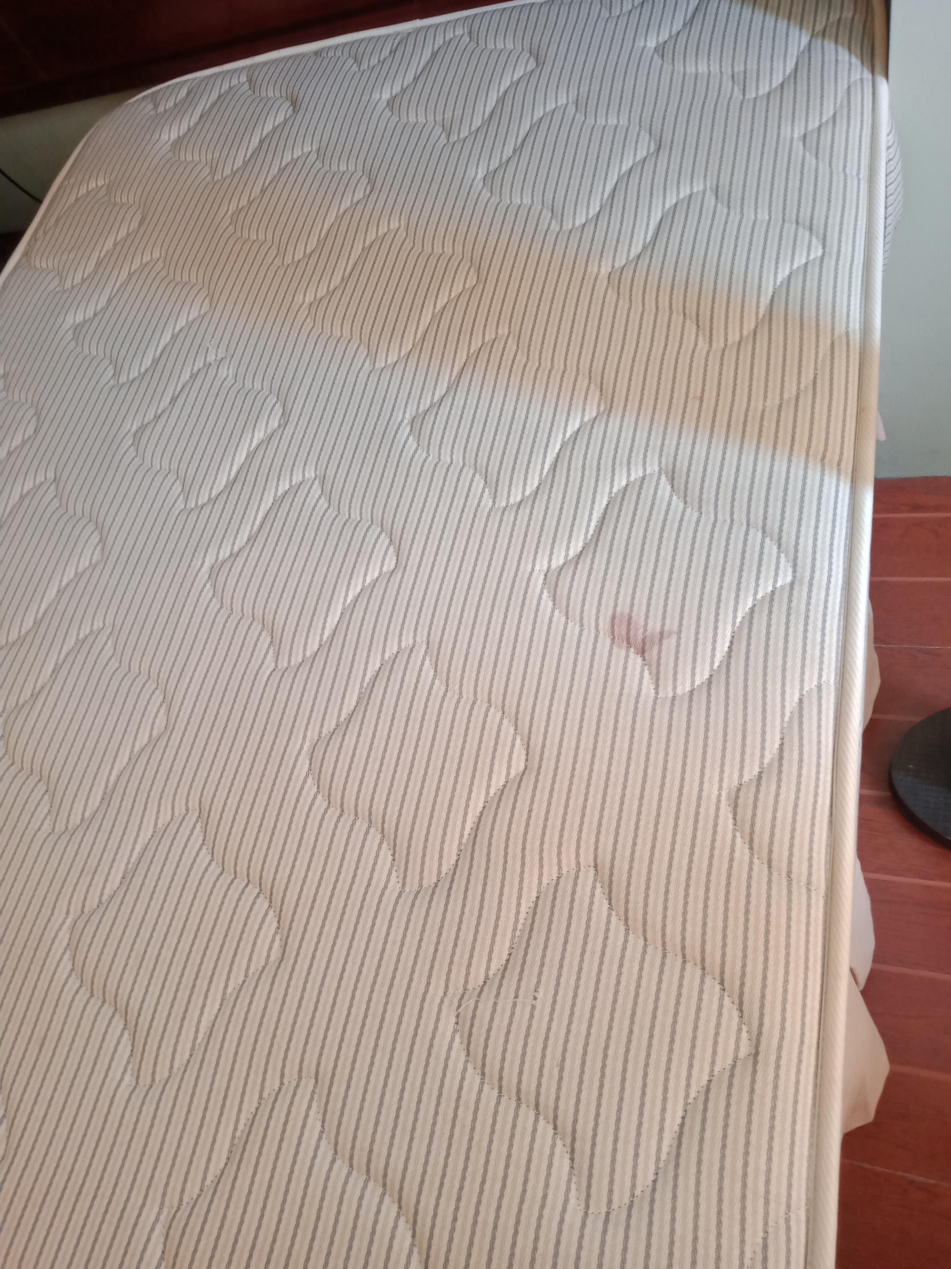 Stained extra mattress not covered