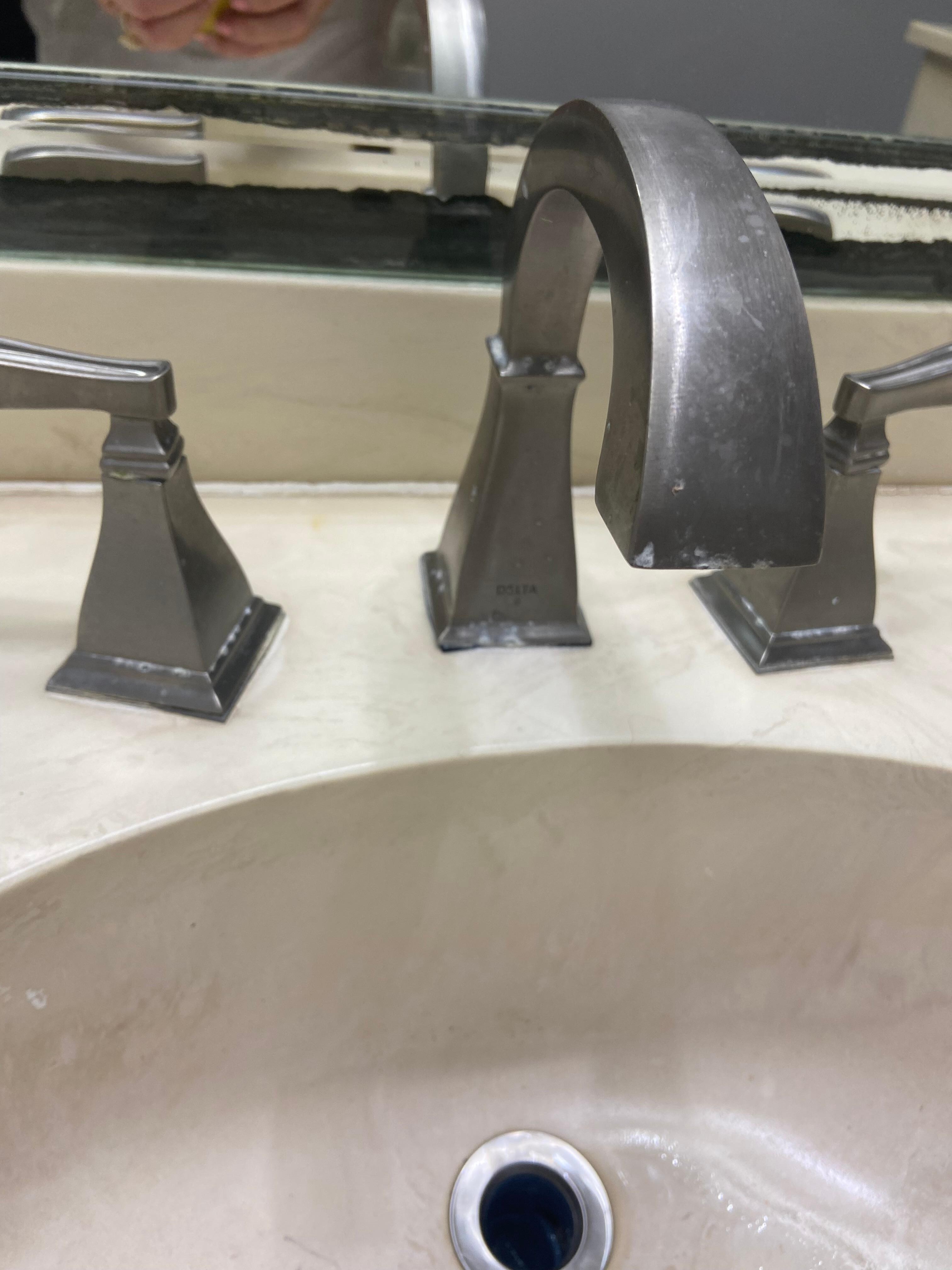 Unclean with old toothpaste on the fixtures, no drain stopper and fixture crooked and broken 