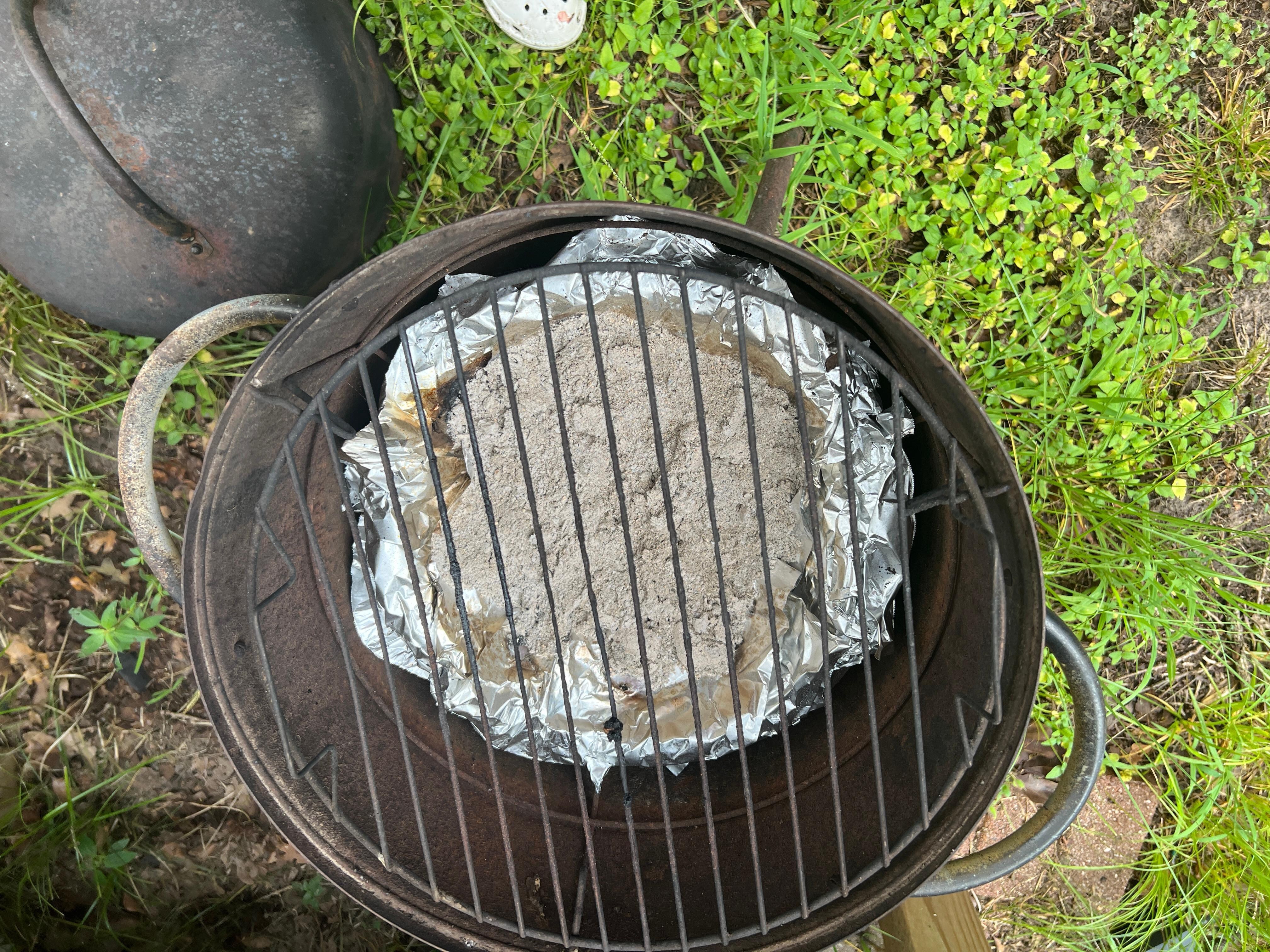 Rusty grill. Had to use aluminum foil to hold charcoal and a disposable grill for the meat.