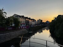 The river that flows through town. You'll walk over this bridge to get to town center.