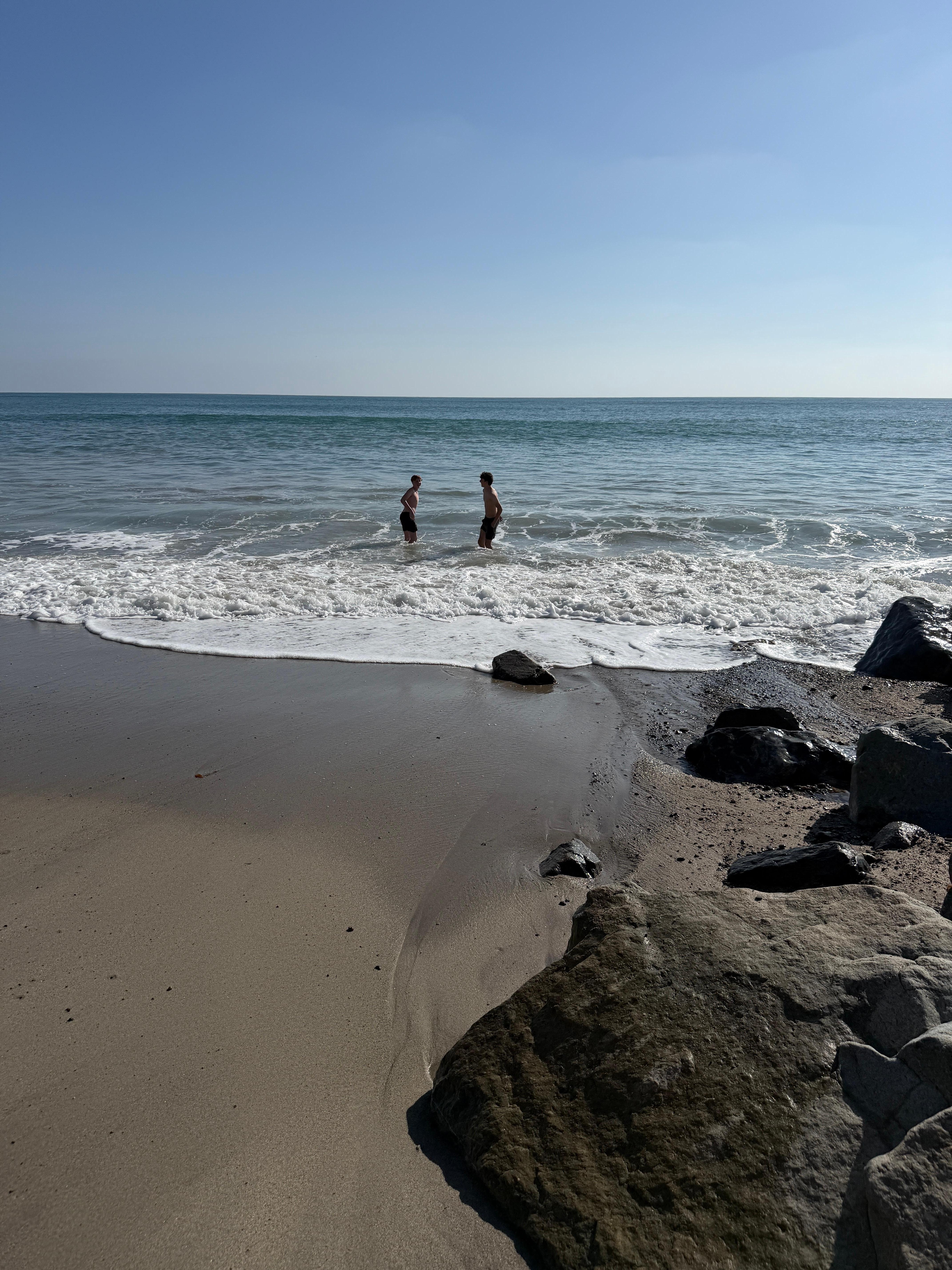 Wading in the waves right out front—amazing ocean energy! The waves can be a little intense at times, so just something to be aware of with younger kids.