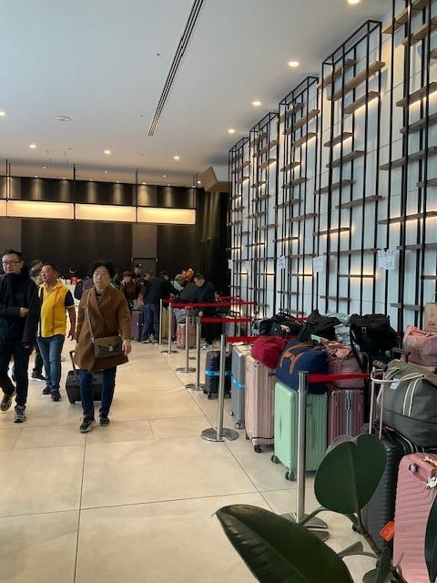 Lobby with multiple tour group’s luggage 