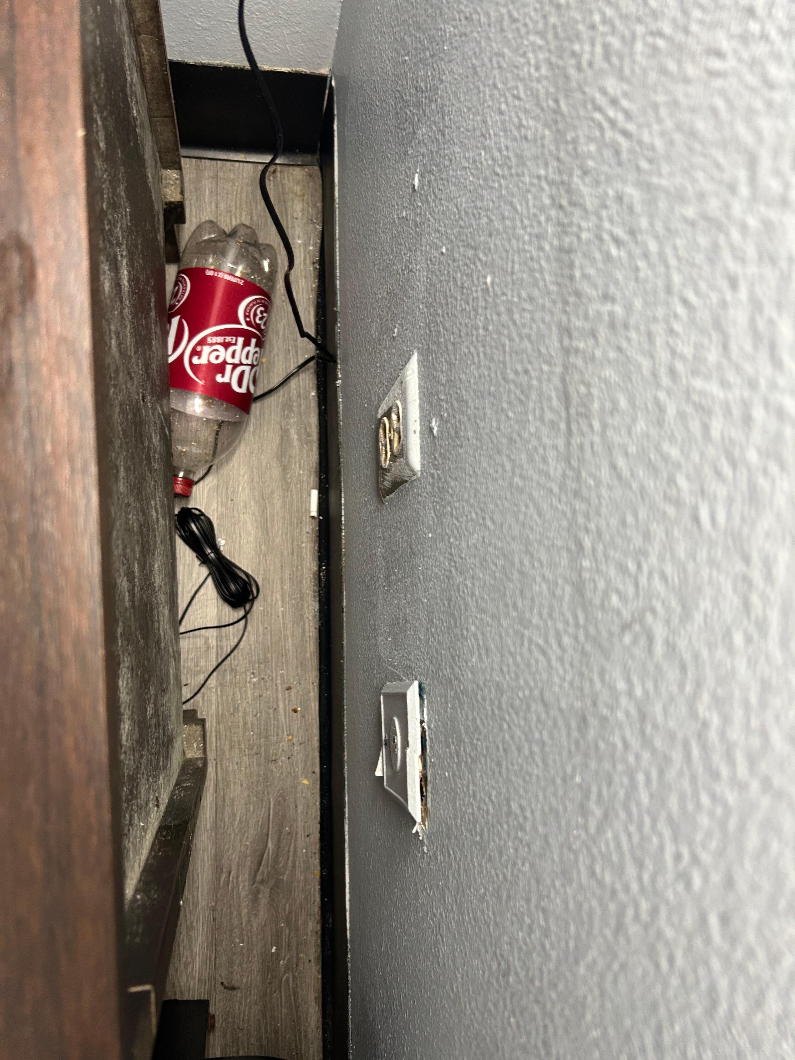 Floor was not swept. This was behind nightstand.