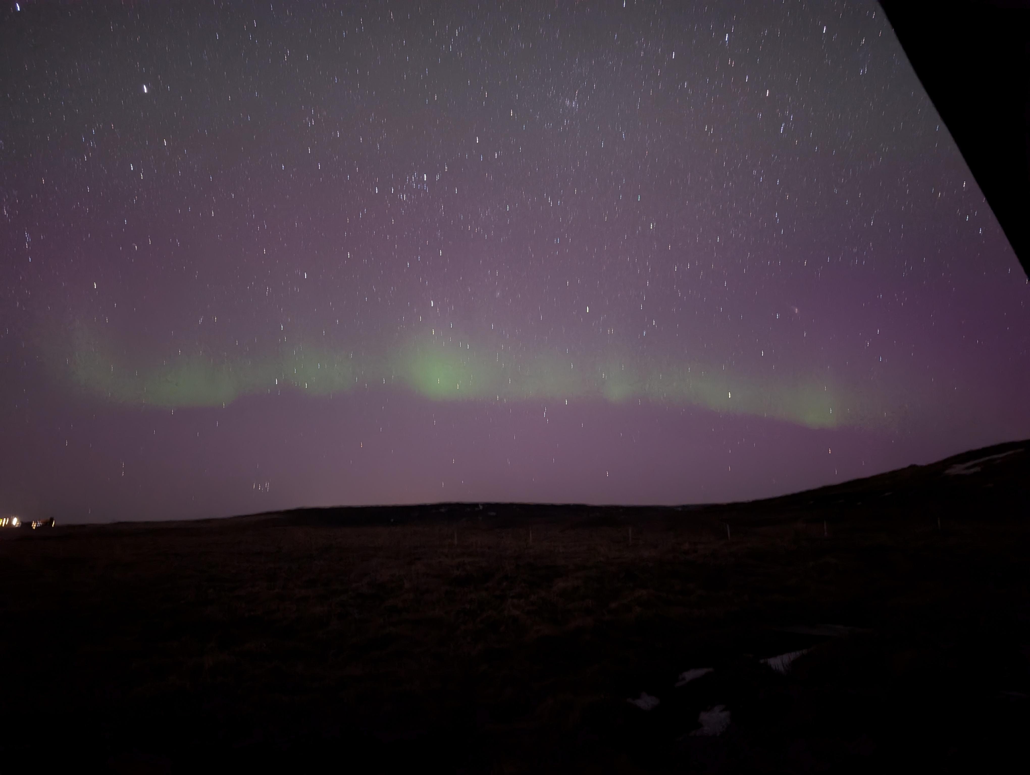 aurora on northern horizon taken just outside of hot tub looking past guest house