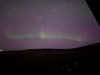 aurora on northern horizon taken just outside of hot tub looking past guest house
