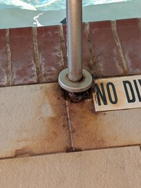 Hand railing for the pool completely rusted out- safety hazard