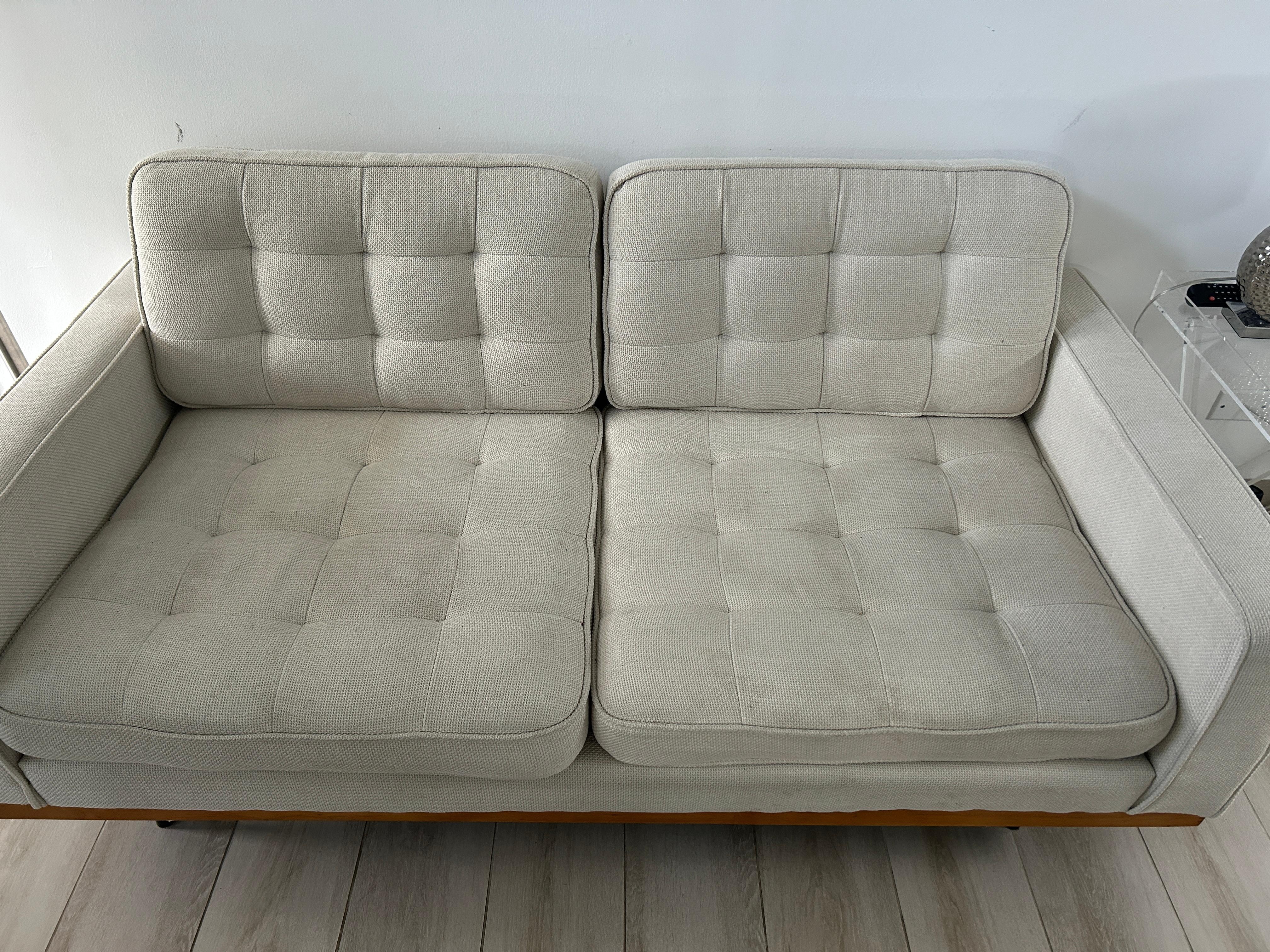 Couch stained - no cushions. TV is above couch so can’t be viewed from the only seating area