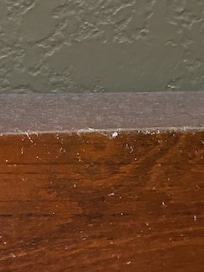 That is the layer of dust on the headboard completely white with dust