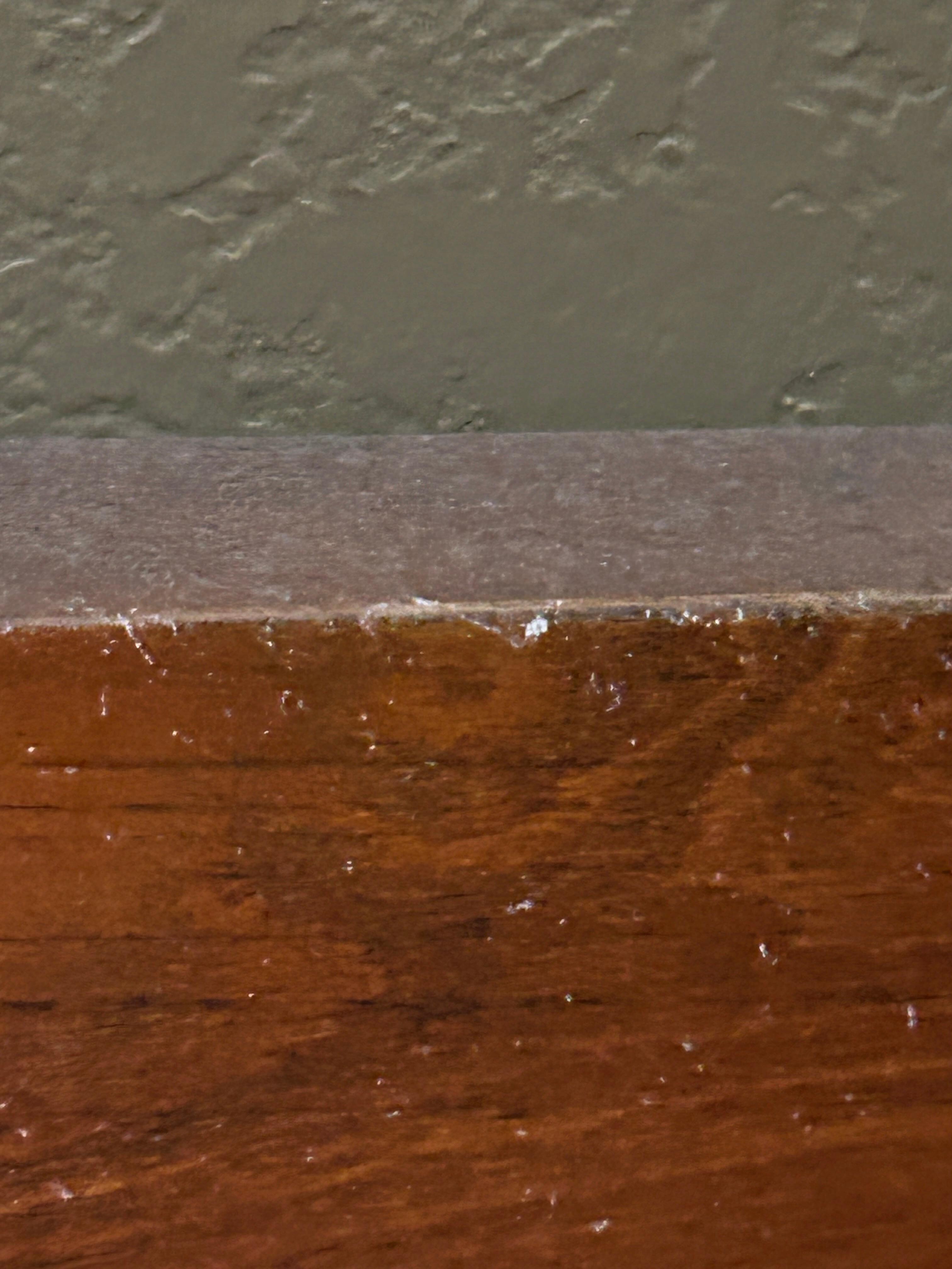 That is the layer of dust on the headboard completely white with dust