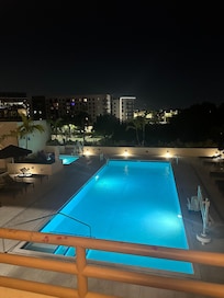 Night time view of the Pool and hot tub area. nice but furniture was stained and dirty