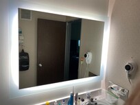 Nice lighting in the bathroom. Nice full length mirror in a lovely frame. Pleasant touches.