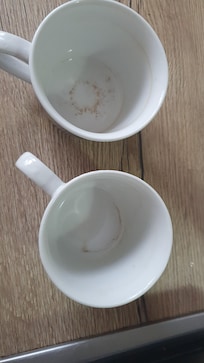 Dirty mugs in cupboard when we arrived
