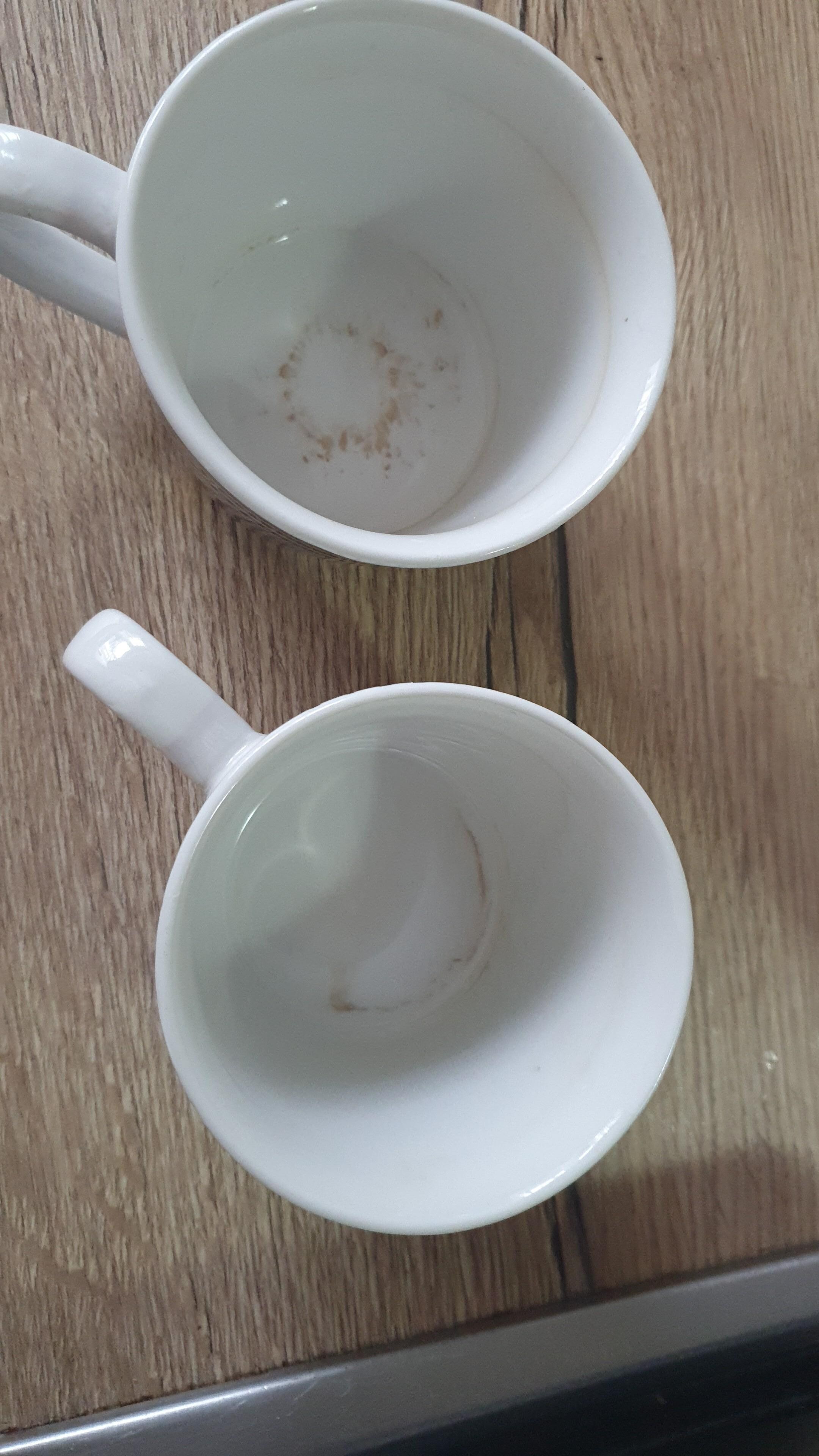 Dirty mugs in cupboard when we arrived