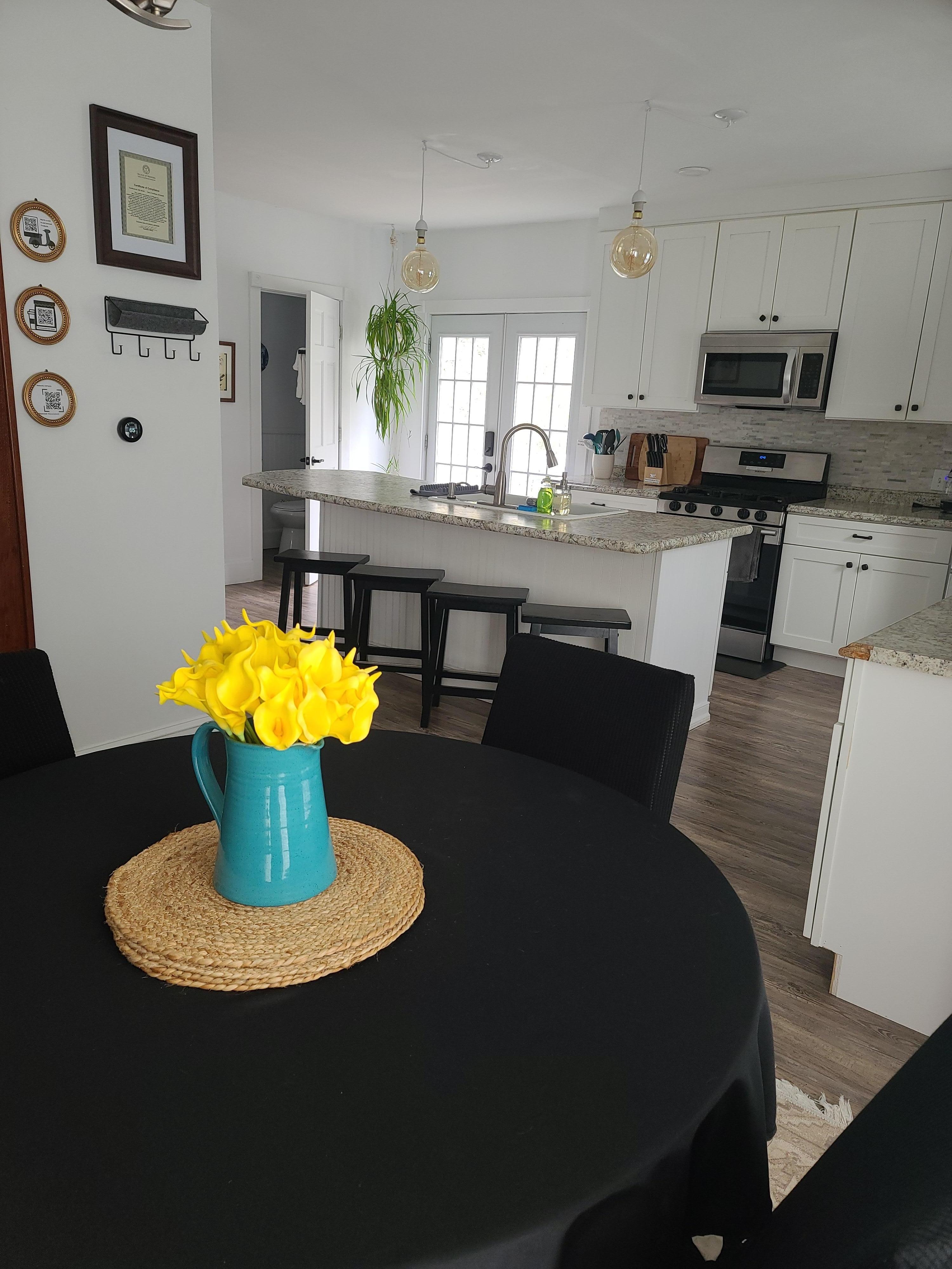 The kitchen is spacious with plenty of counter space to prep, cook, serve, and gather. 