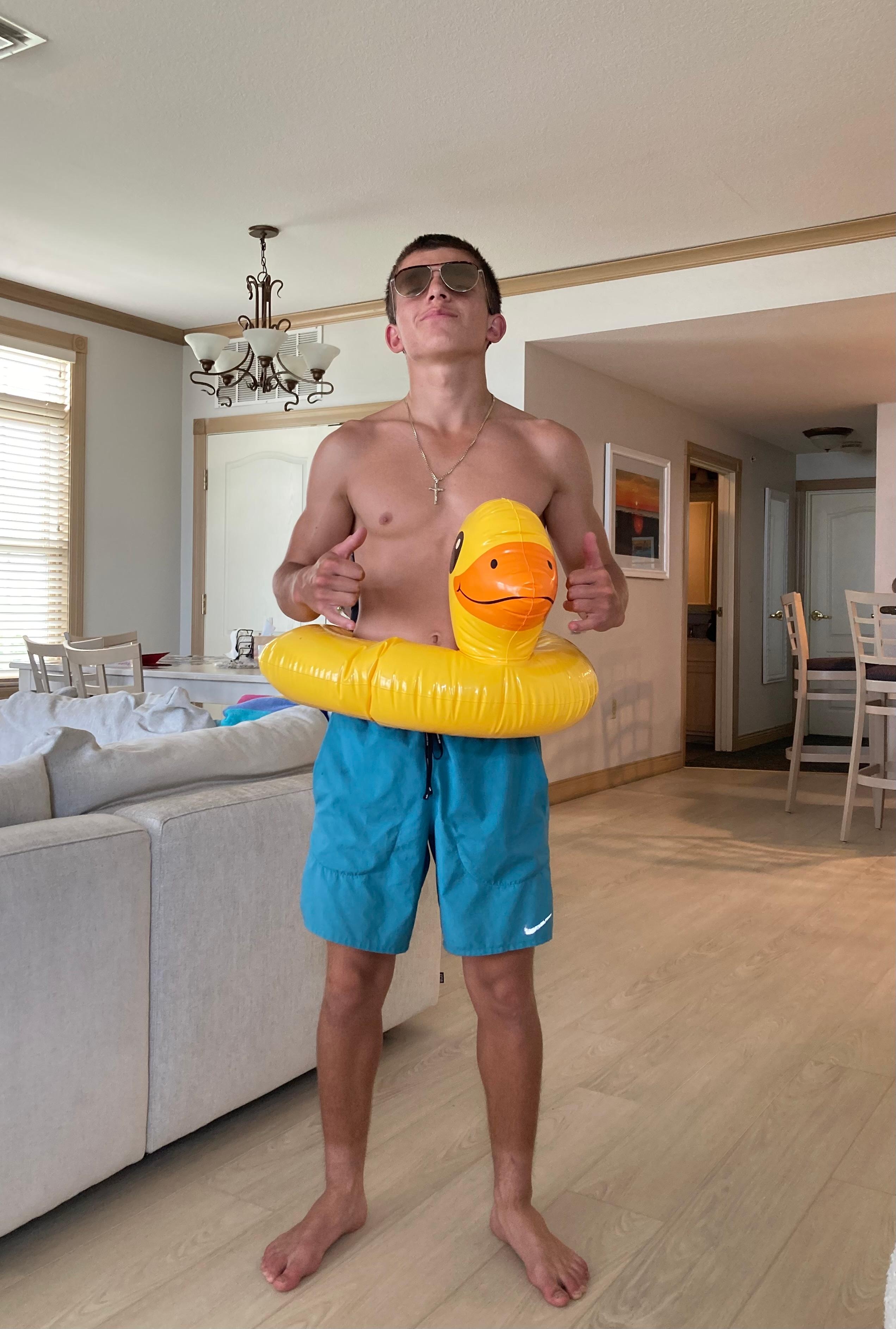 Grandson pulling a water toy out of the closet; he sent this to his teenage buddies.  