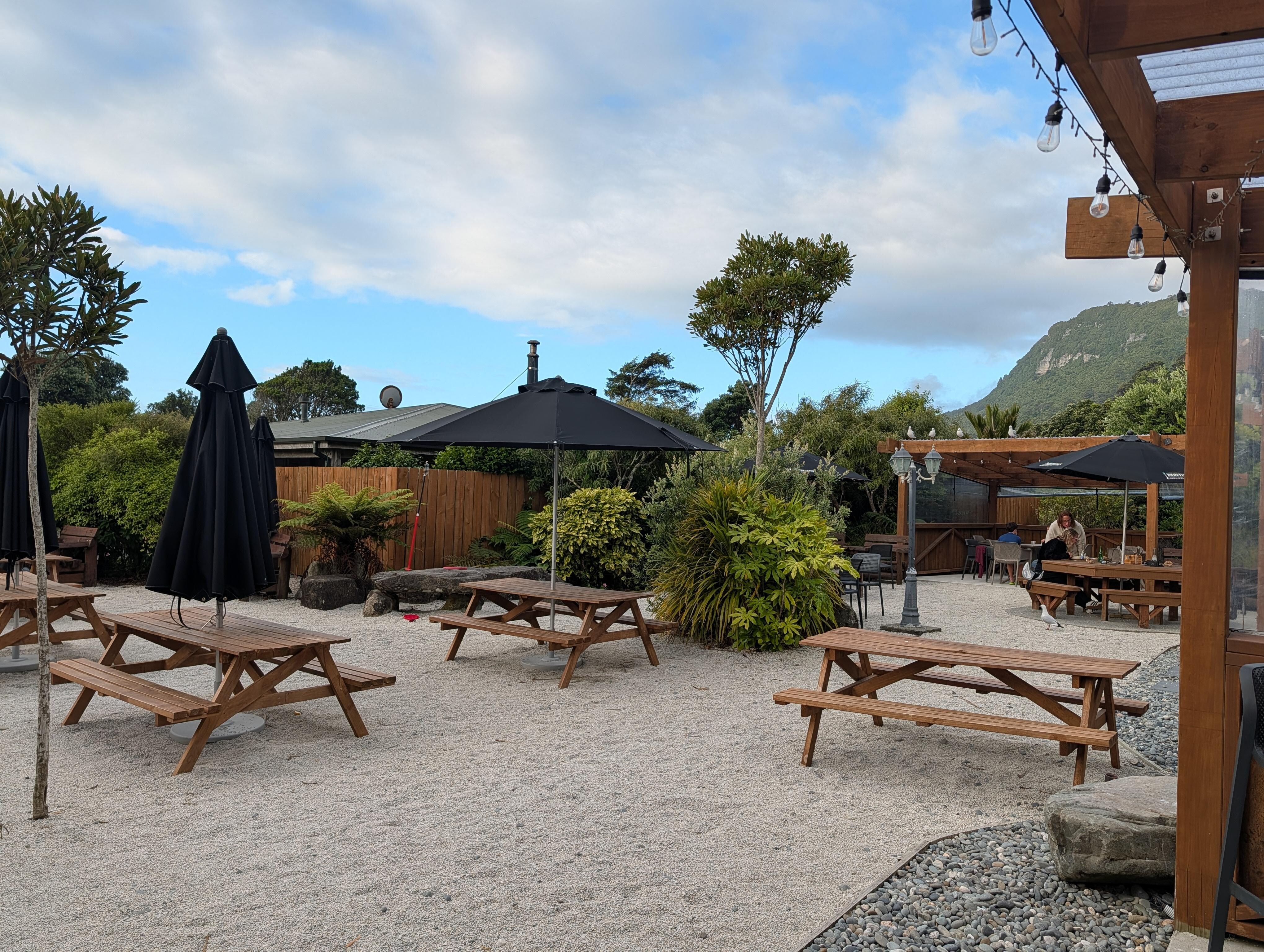 Outdoor seating at the nearby restaurant.