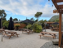 Outdoor seating at the nearby restaurant.