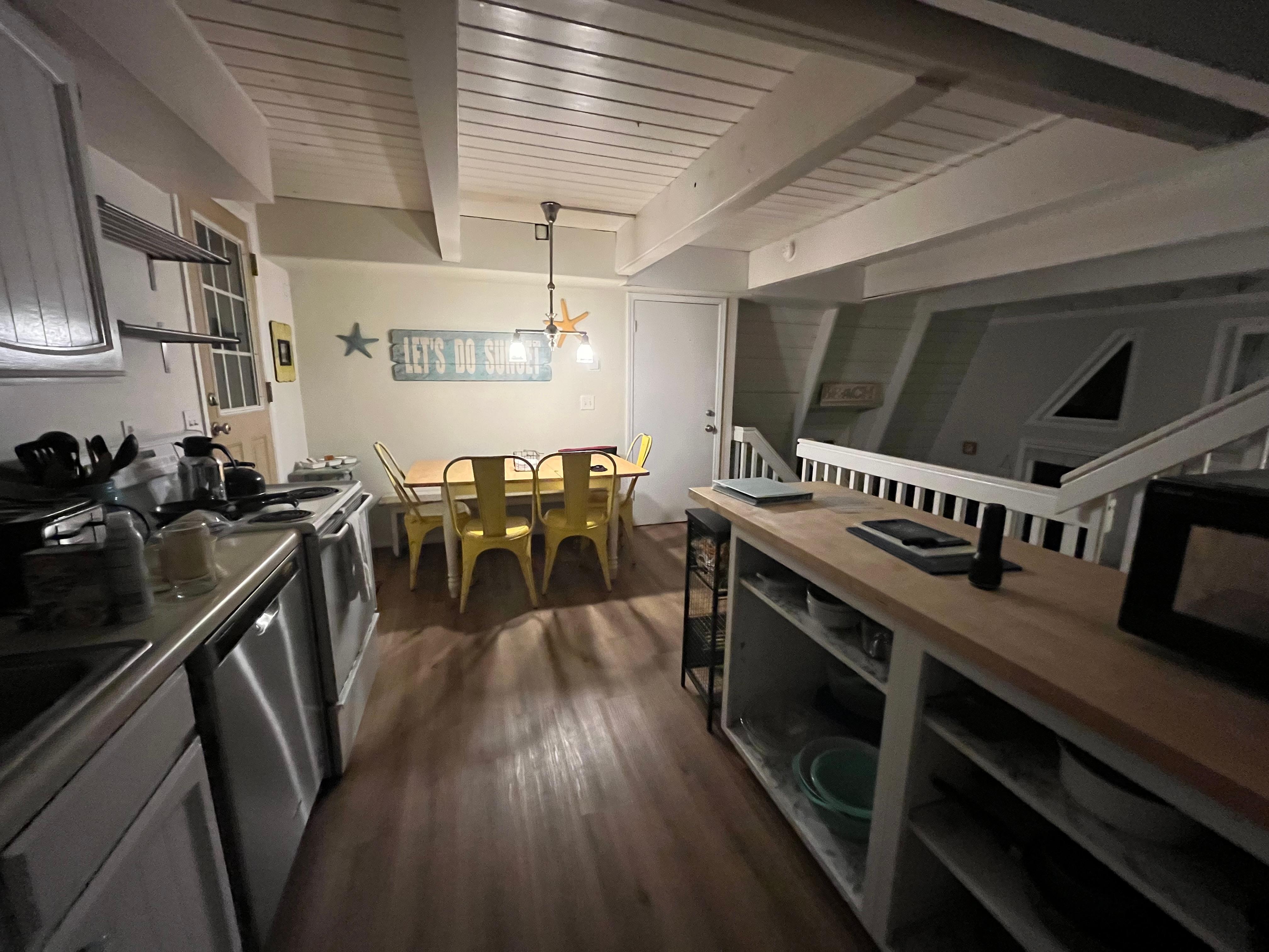 Kitchen and dining area level has door out to the large balcony shown in my first pic (river side). I saw a grill on that deck/balcony and it would be a nice place to sit in good weather.