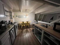 Kitchen and dining area level has door out to the large balcony shown in my first pic (river side). I saw a grill on that deck/balcony and it would be a nice place to sit in good weather.