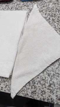 Dingy facecloth. I'd use for cleaning or dusting before offer this to a customer.