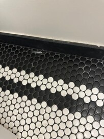 Dirty/ powder debris on bathroom floor