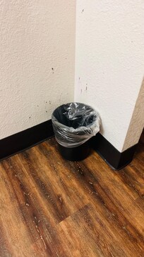 The room was in poor shape — the floors were scratched, the walls had stains, and the corners looked as though they hadn’t been cleaned in months.