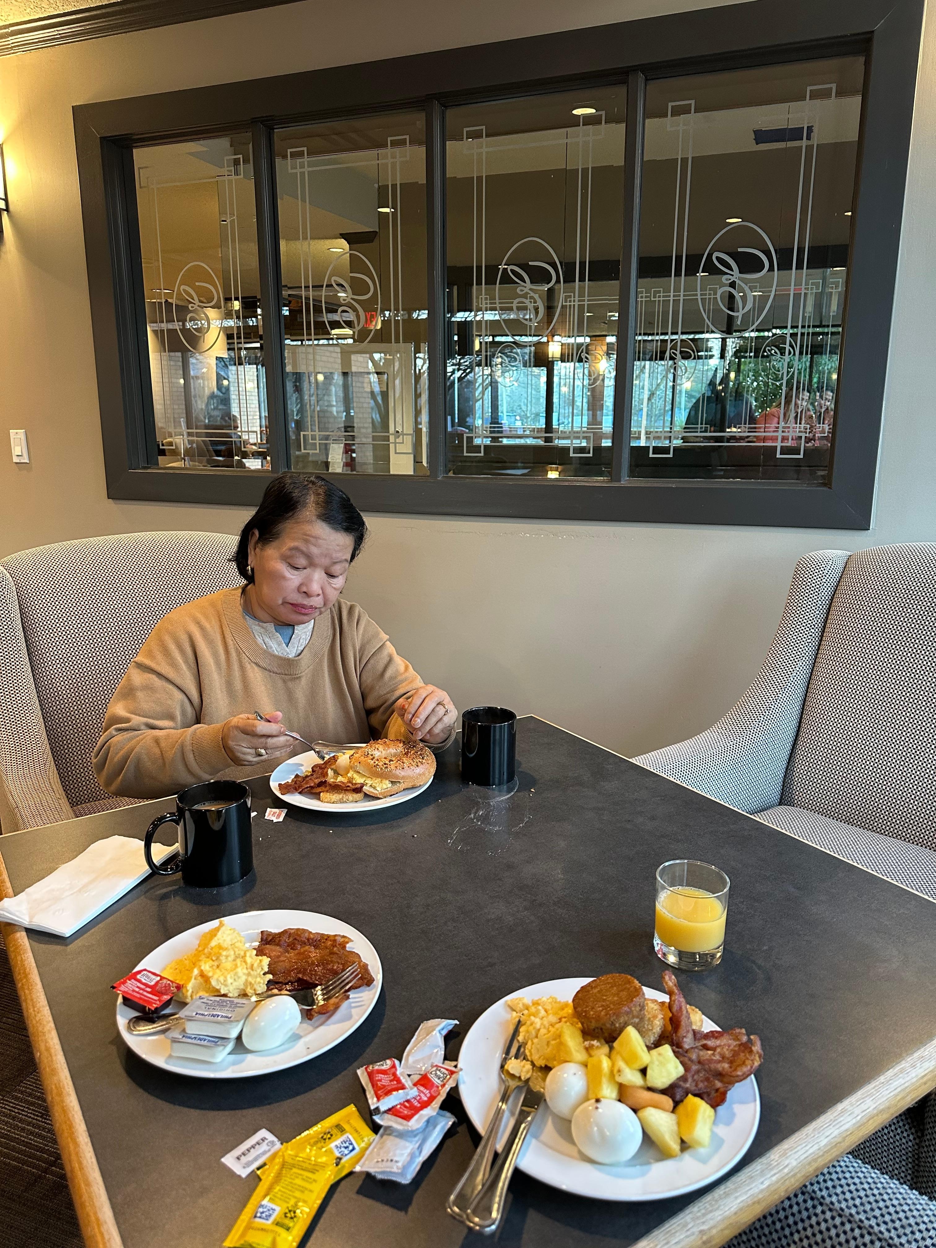 My mom enjoying her breakfast.