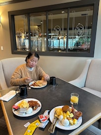 My mom enjoying her breakfast.