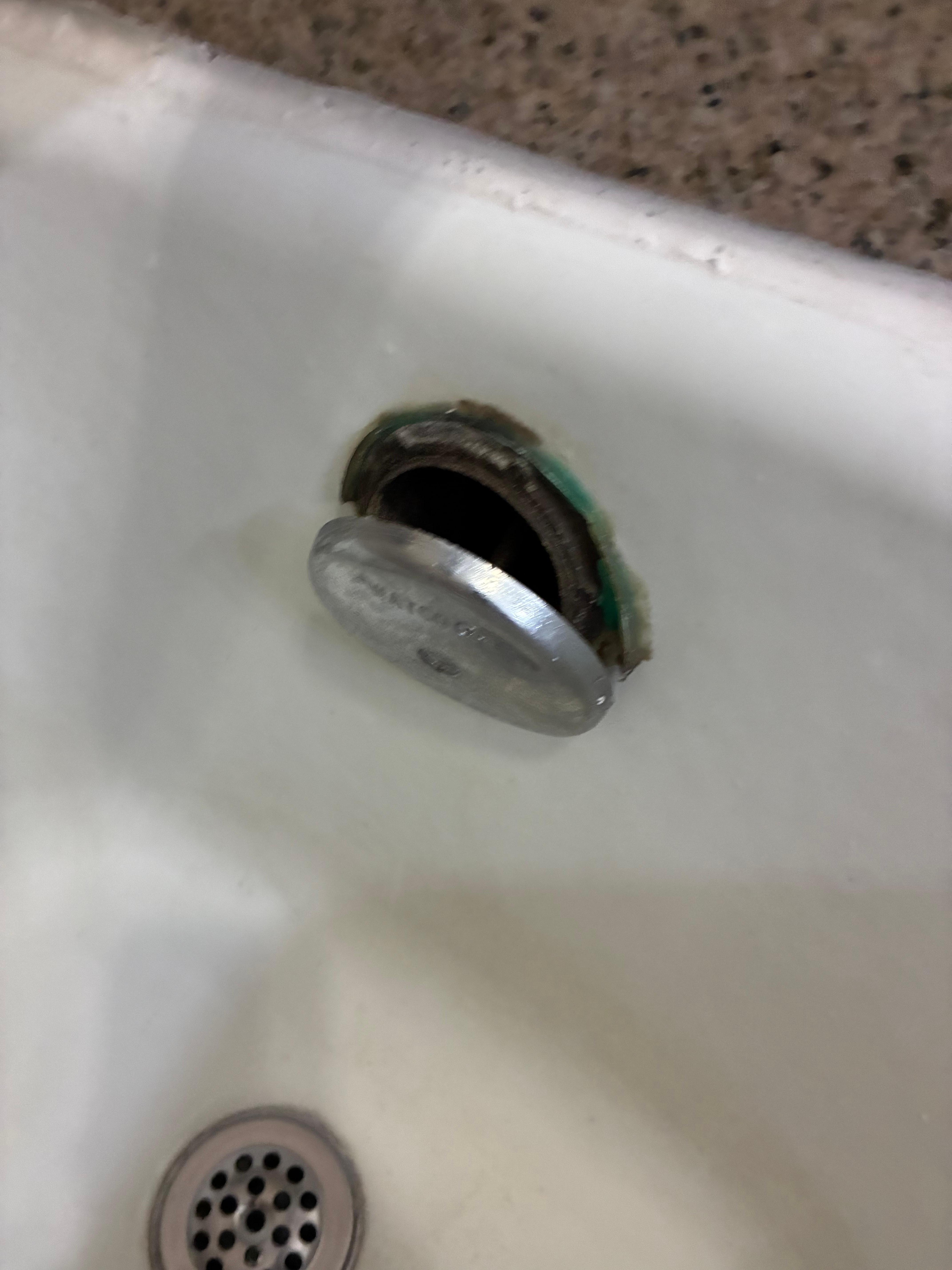 Bathtub piece falling out and no way to secure it.