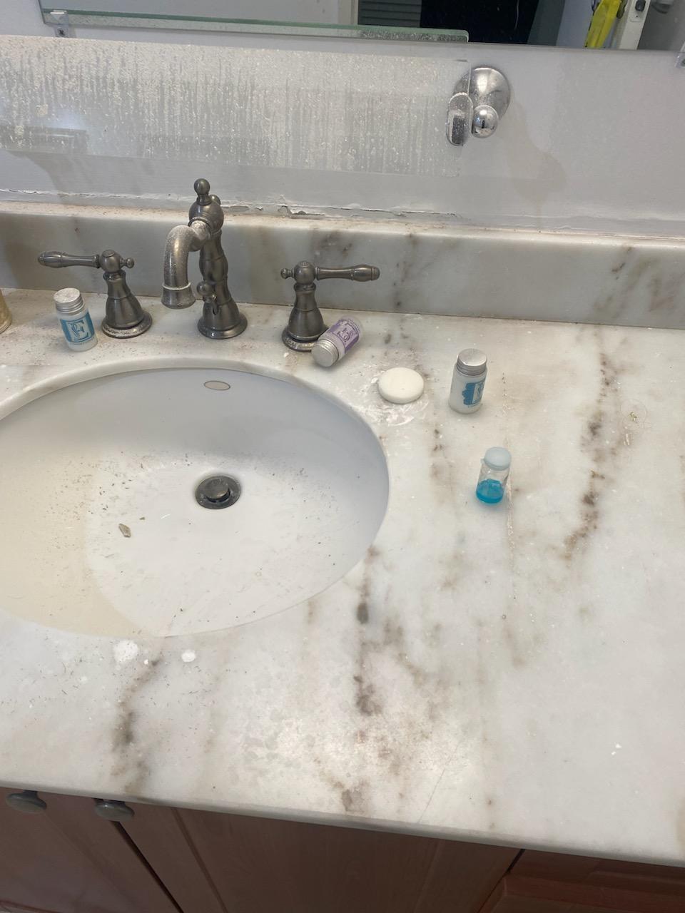 Uncleaned sink; leftover toiletries