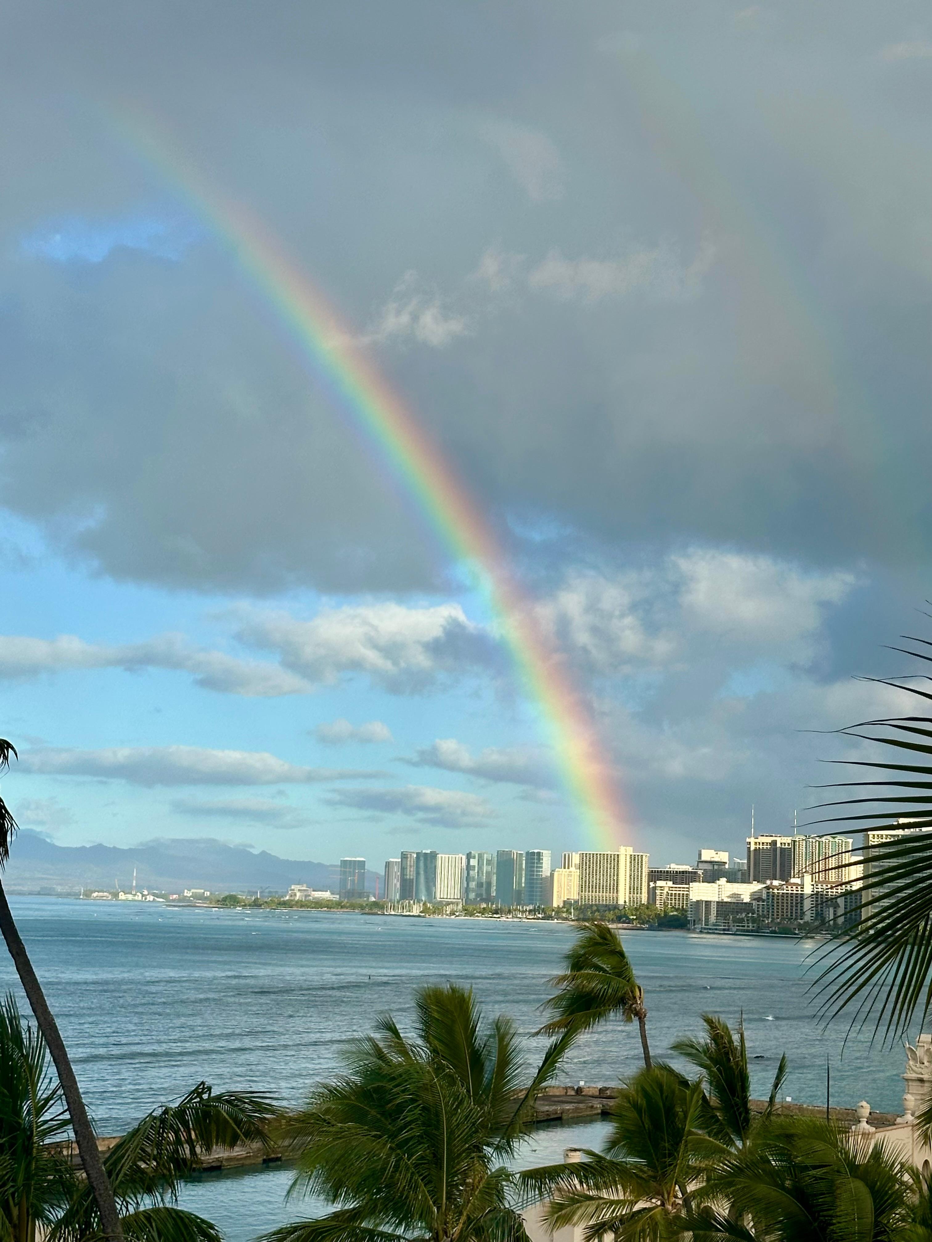 View from balcony of rainbow over Waikiki.
