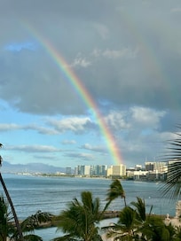 View from balcony of rainbow over Waikiki.