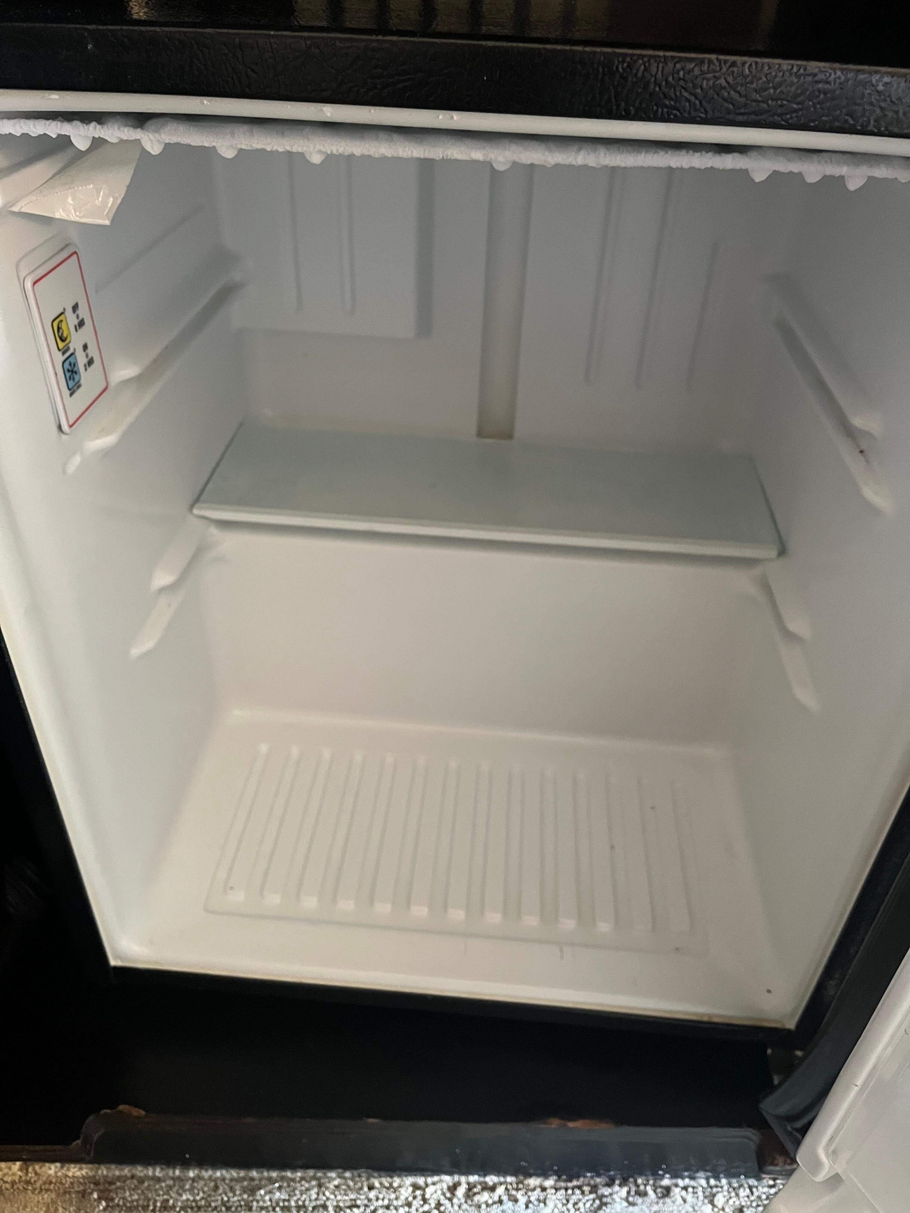 To fix fridge he took out all the shelves