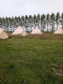 The tents are in a semicircle close to each other